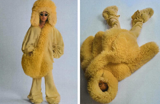 North West dressed in a yellow jacket, sunglasses, pants and bag, simulating a lion costume